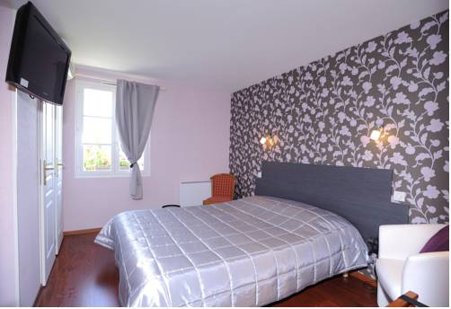 Imagen de la habitación del Hotel Relais Du Silence Aux Maisons. Foto 11
