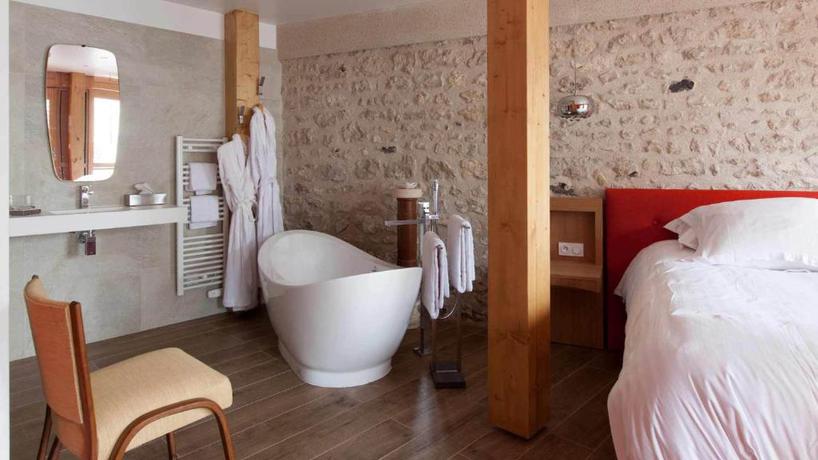 Imagen de la habitación del Hotel Relais Du Silence Le Jardin Des Plumes. Foto 7