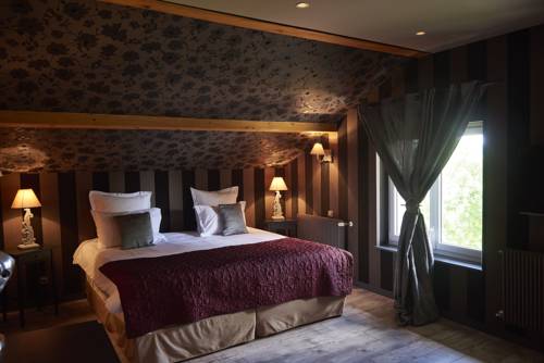 Imagen de la habitación del Hotel Relais Du Silence Le Manoir Des Montagnes. Foto 4