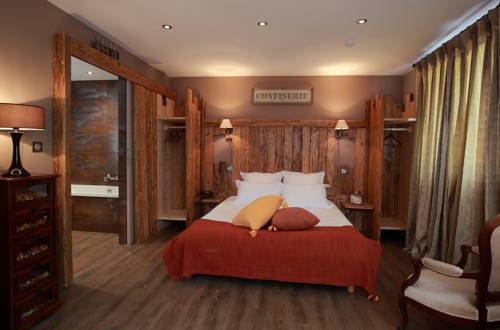 Imagen de la habitación del Hotel Relais Du Silence Le Manoir Des Montagnes. Foto 12