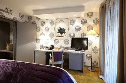 Imagen de la habitación del Hotel Relais Et Ch&acirc;teaux Le Chambard. Foto 8