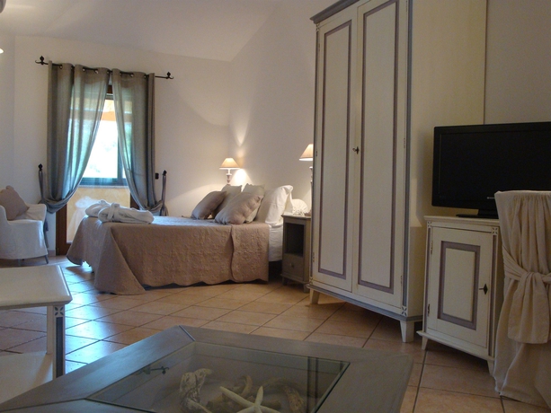 Imagen de la habitación del Hotel Relais Fenicottero Rosa. Foto 3