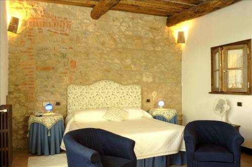 Imagen de la habitación del Hotel Relais La Chiusa. Foto 11