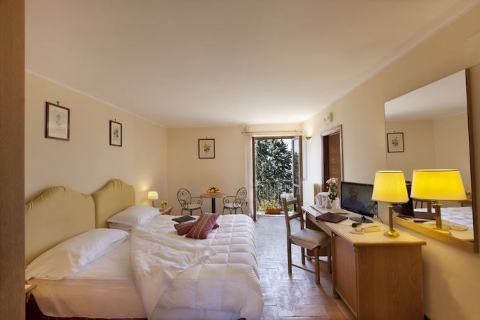 Imagen de la habitación del Hotel Relais La Fattoria, Passignano Sul Trasimeno. Foto 9
