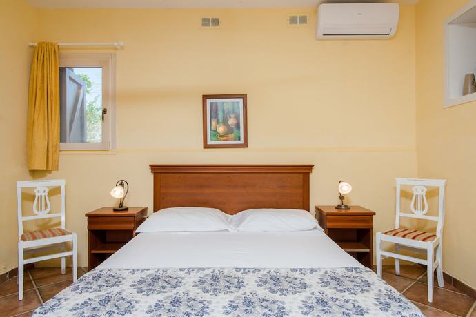 Imagen de la habitación del Hotel Relais Masseria Casina Dei Cari. Foto 7