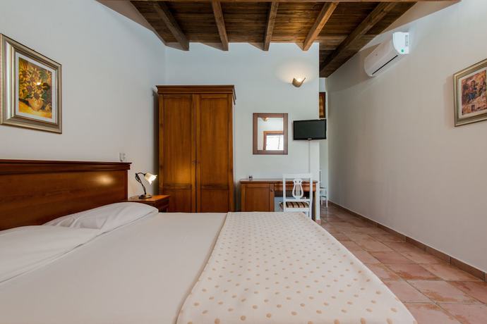 Imagen de la habitación del Hotel Relais Masseria Casina Dei Cari. Foto 15