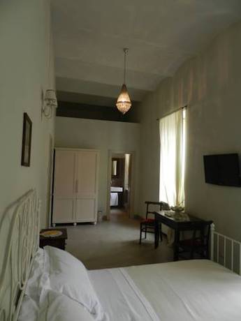 Imagen de la habitación del Hotel Relais Real Collegio. Foto 6