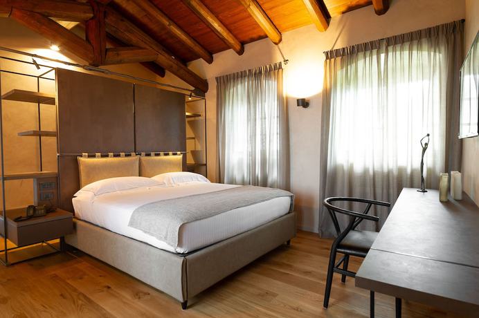 Imagen de la habitación del Hotel Relais San Vigilio al Castello. Foto 14