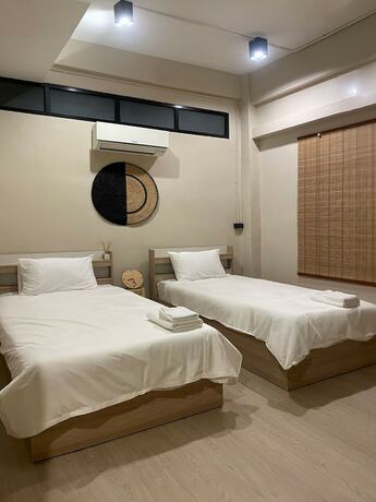 Imagen de la habitación del Hotel Rema, Bangkok. Foto 19