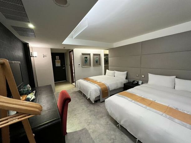 Imagen de la habitación del Hotel Ren Mei Fashion. Foto 12