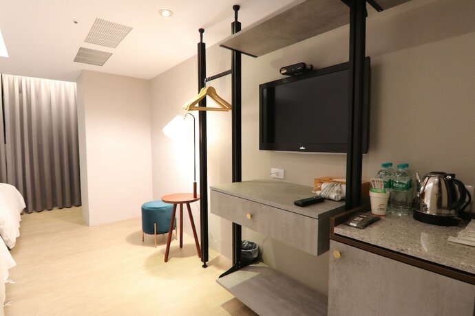 Imagen de la habitación del Hotel Ren Mei Fashion. Foto 23