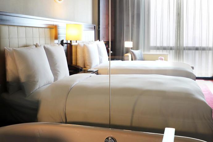 Imagen de la habitación del Hotel Renaissance Beijing Capital. Foto 8