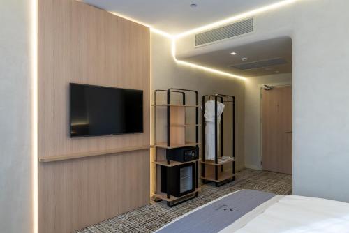 Imagen de la habitación del Hotel Renion City. Foto 15