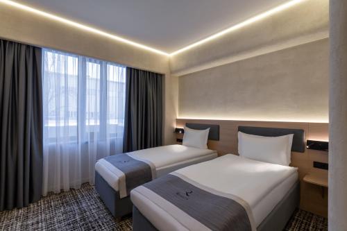 Imagen de la habitación del Hotel Renion City. Foto 18