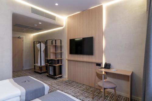 Imagen de la habitación del Hotel Renion City. Foto 20