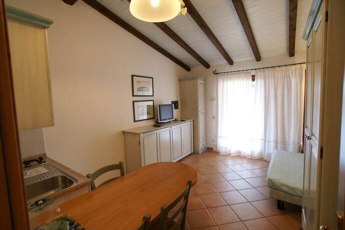 Imagen de la habitación del Hotel Residence Baia Caddinas. Foto 15
