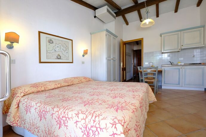 Imagen de la habitación del Hotel Residence Baia Caddinas. Foto 17