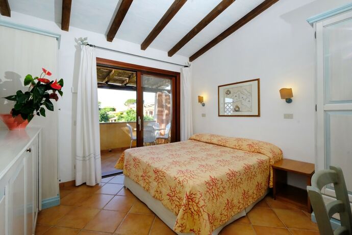 Imagen de la habitación del Hotel Residence Baia Caddinas. Foto 19