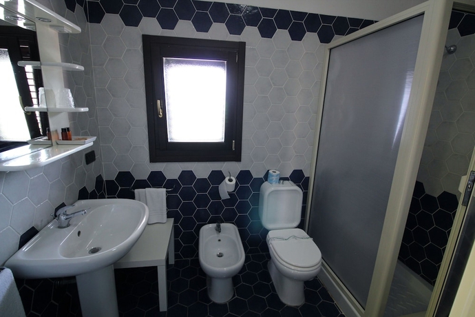 Imagen de la habitación del Hotel Residence Capo Campolato. Foto 13