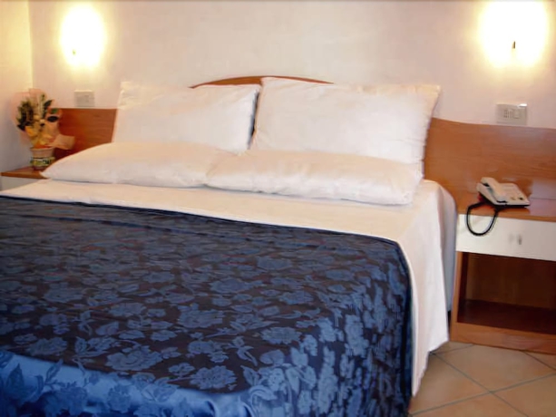 Imagen de la habitación del Hotel Residence La Taverna. Foto 7