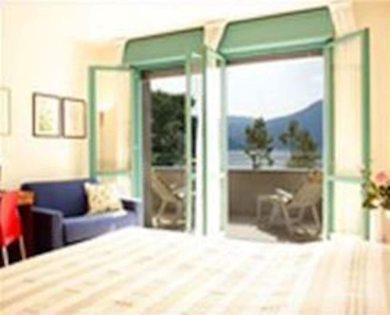 Imagen de la habitación del Hotel Residence Porto Letizia. Foto 6