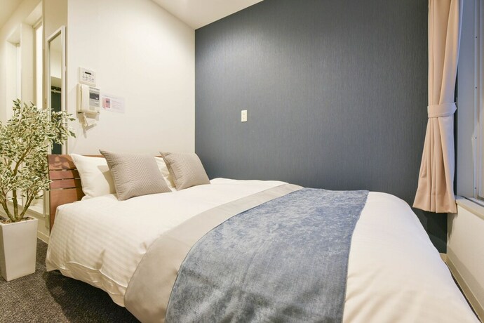 Imagen de la habitación del Hotel Residence Stripe Sapporo. Foto 12
