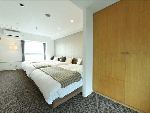 Imagen de la habitación del Hotel Residence Stripe Sapporo. Foto 16