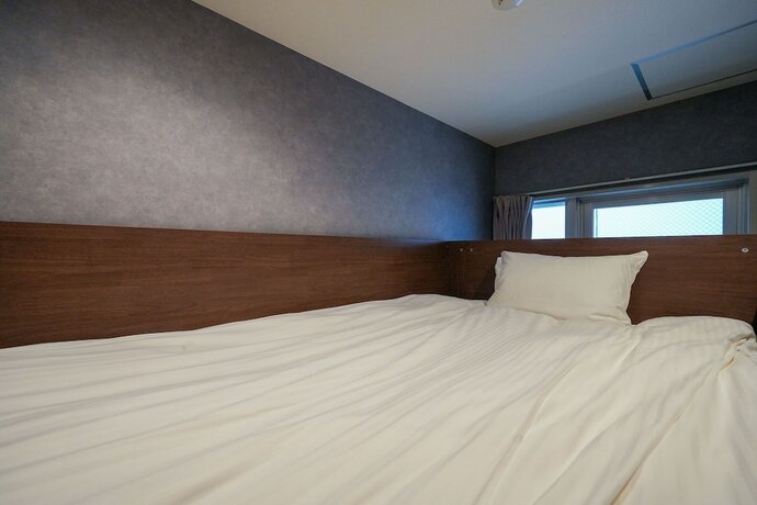 Imagen de la habitación del Hotel Residence Stripe Sapporo. Foto 22