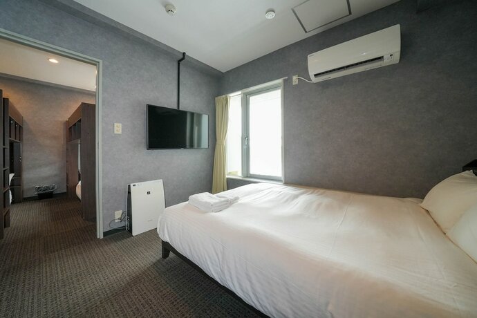 Imagen de la habitación del Hotel Residence Stripe Sapporo. Foto 25
