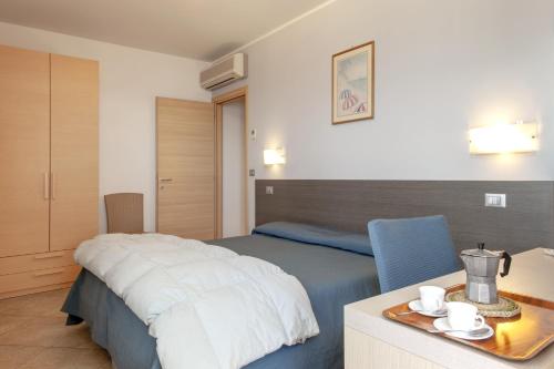 Imagen de la habitación del Hotel Residence Villa Lo Scoglietto. Foto 6