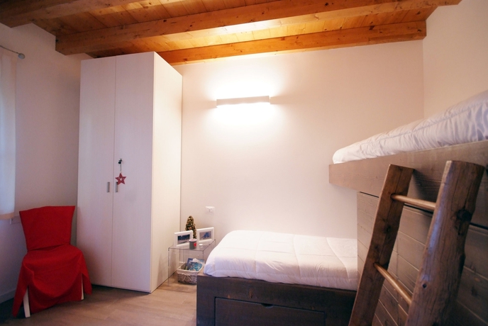 Imagen de la habitación del Hotel Residence Villaggio Delle Alpi. Foto 8