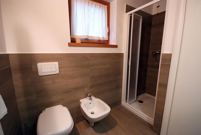 Imagen de la habitación del Hotel Residence Villaggio Delle Alpi. Foto 9