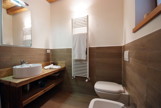 Imagen de la habitación del Hotel Residence Villaggio Delle Alpi. Foto 12