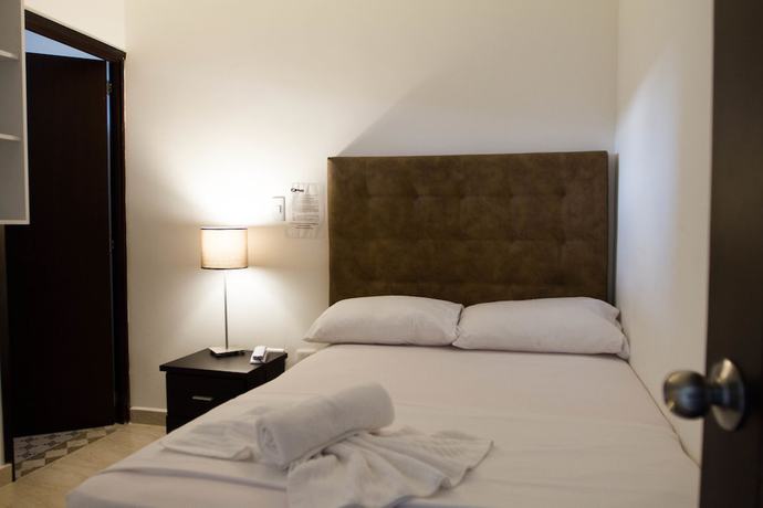 Imagen de la habitación del Hotel Residencias La Che. Foto 4