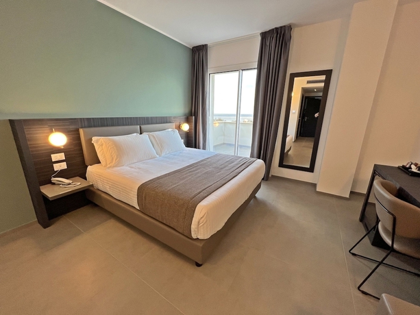 Imagen de la habitación del Hotel Resort La Battigia Beach And Spa. Foto 10