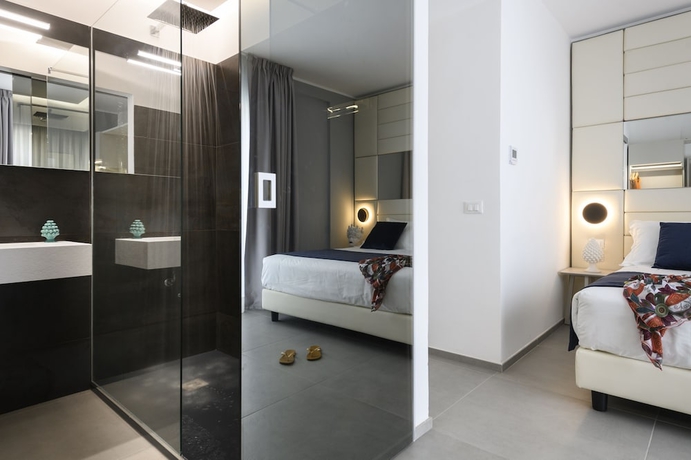 Imagen de la habitación del Hotel Resort La Battigia Beach And Spa. Foto 14