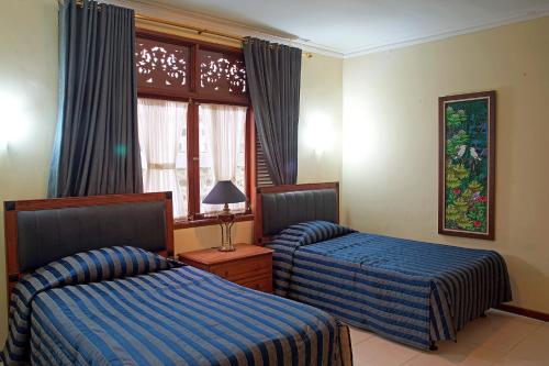 Imagen de la habitación del Hotel Resort Prima Sangkanhurip. Foto 18