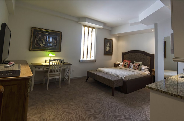 Imagen de la habitación del Hotel Retro Suites. Foto 18