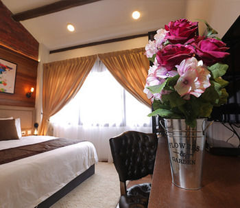 Imagen de la habitación del Hotel Reunion Heritage House. Foto 10