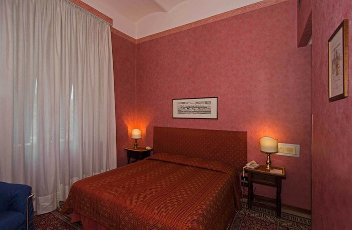 Imagen de la habitación del Hotel Rex, Lucca. Foto 4