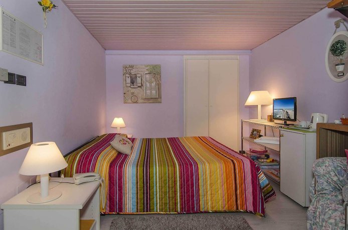 Imagen de la habitación del Hotel Rex, Lucca. Foto 7