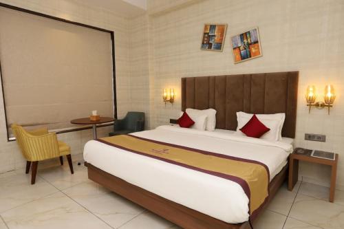 Imagen de la habitación del Hotel Reyansh Pride Boisar. Foto 17