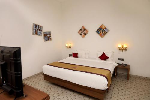 Imagen de la habitación del Hotel Reyansh Pride Boisar. Foto 19