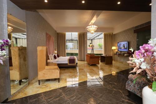 Imagen de la habitación del Hotel Reyansh Pride Boisar. Foto 20