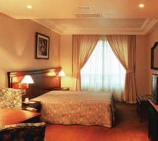 Imagen de la habitación del Hotel Reynolds International. Foto 2