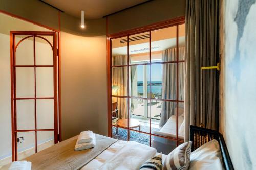 Imagen de la habitación del Hotel Rezident Tomis Marina. Foto 20