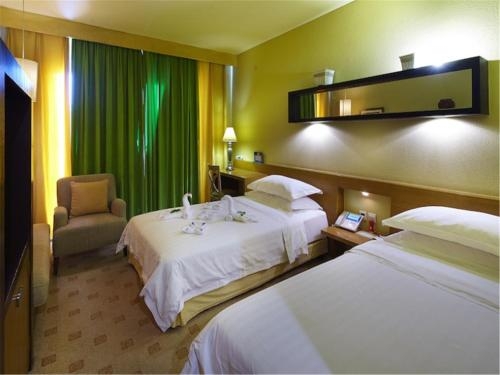 Imagen de la habitación del Hotel Rghcm Garden Resorts. Foto 6