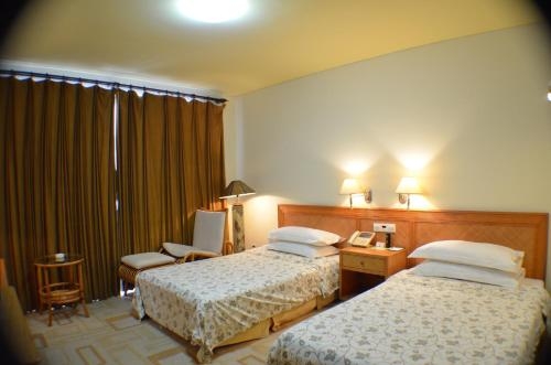 Imagen de la habitación del Hotel Rghcm Garden Resorts. Foto 7