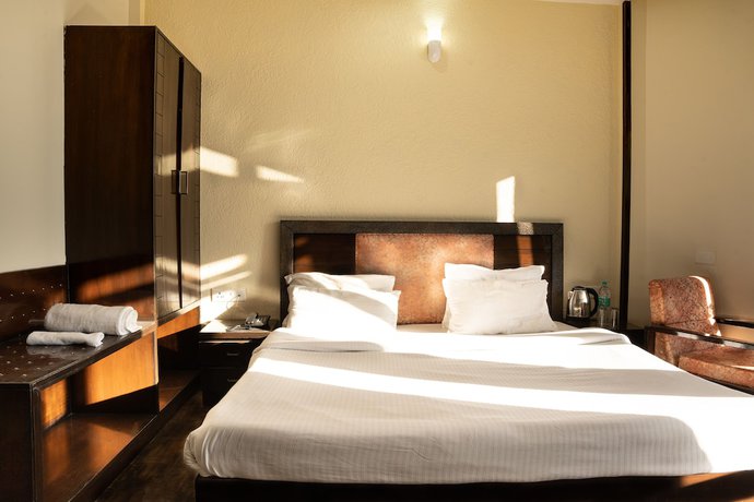 Imagen de la habitación del Hotel Rhodo Inn. Foto 9