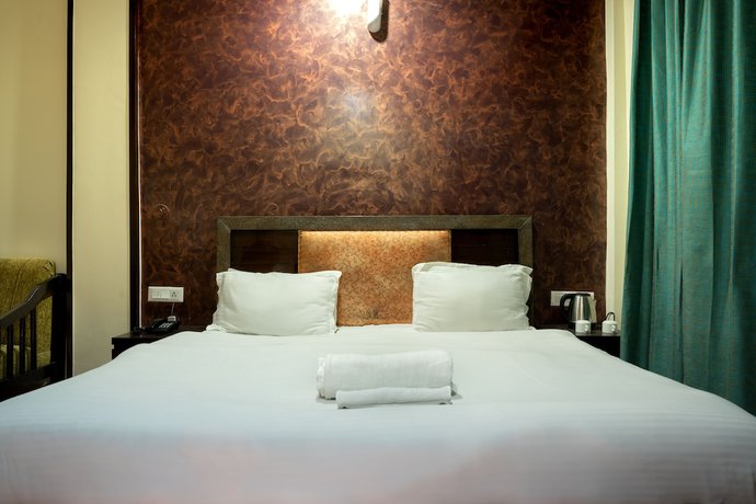 Imagen de la habitación del Hotel Rhodo Inn. Foto 13
